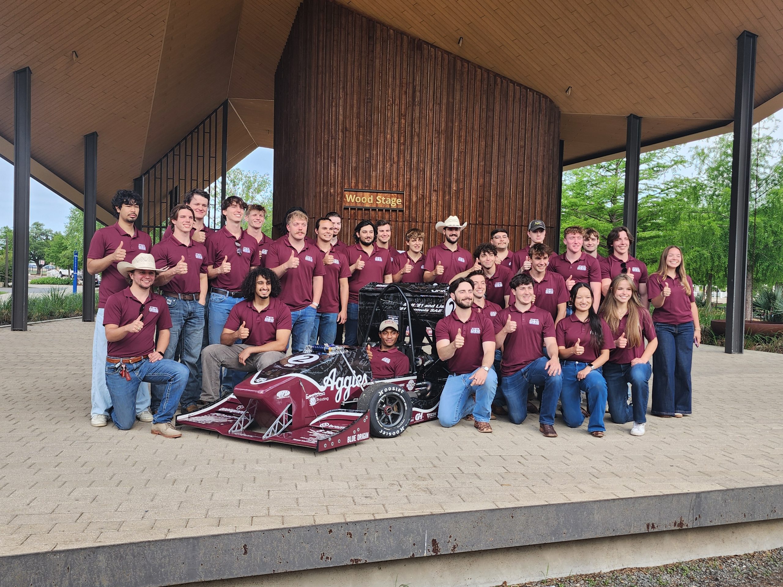 Photo of 2025-26 TAMU Formula SAE IC team at April 2026 rollout event